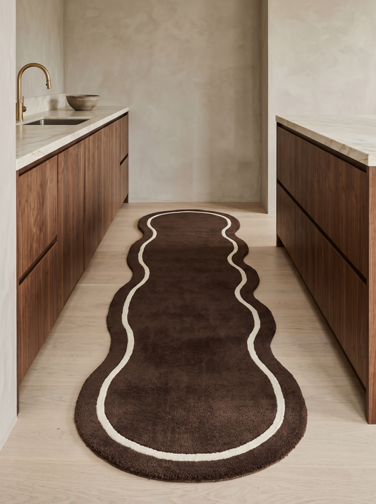 Brown Wavy Runner Rug with a deep chocolate brown pile and an ivory contour line following its organic, undulating shape