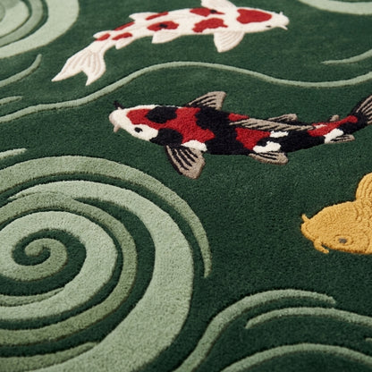 Dark Green Koi Fish Rug in hand-tufted wool with three carved koi in red, white, black and gold swimming among sage green swirling water spirals on a forest green cloud shape - view 4