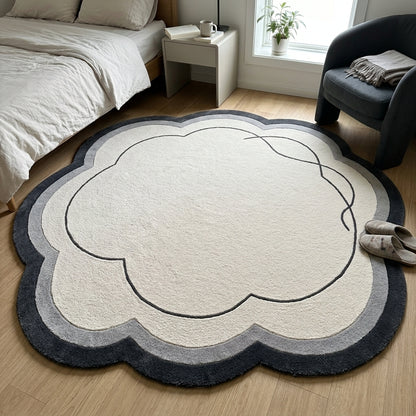 Ivory Cloud Rug in hand-tufted wool with a scalloped flower shape, ivory field, charcoal and grey border and a flowing carved charcoal line - view 3