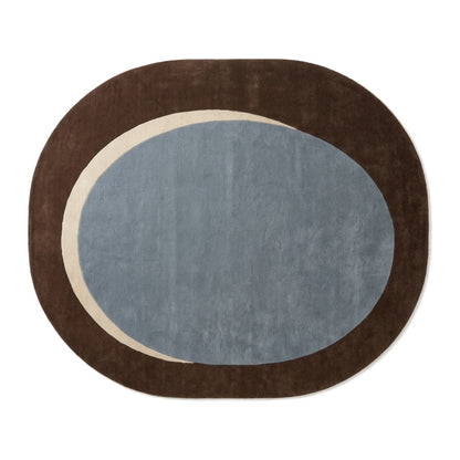 Slate Blue Oval Rug in hand-tufted wool with a slate blue oval centre, a sand crescent and a wide chocolate brown oval border - view 2