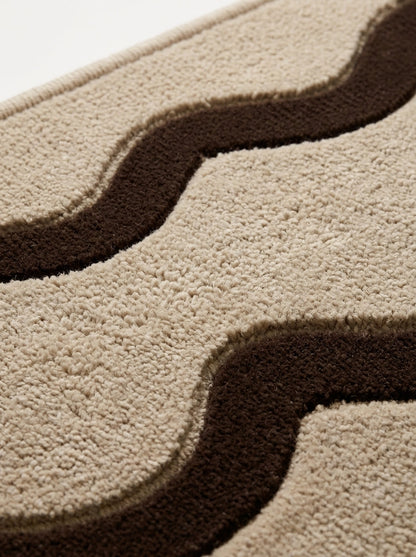 Beige Squiggle Runner Rug in textured wool with two raised chocolate brown wavy lines and carved outlines