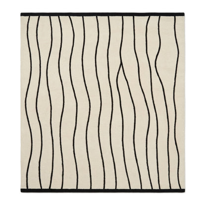 Black and White Wavy Line Rug with an ivory ground, flowing black stripes, and a crisp black border