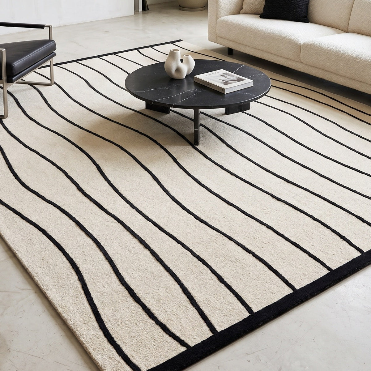 Black and White Wavy Line Rug with ivory wool pile, flowing black lines and a crisp black border