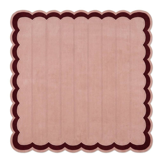 Blush Pink Fluted wool rug with carved vertical channels, deep burgundy border and scalloped edges.