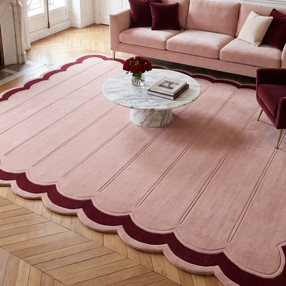 Blush Pink Fluted wool rug with carved channel lines, burgundy border and scalloped edge, hand-tufted with plush pile.