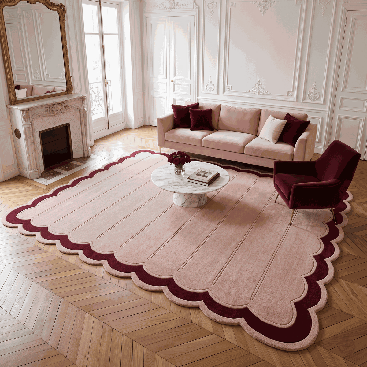 Blush Pink Fluted wool rug with carved vertical channels and a scalloped edge framed by a deep burgundy border.