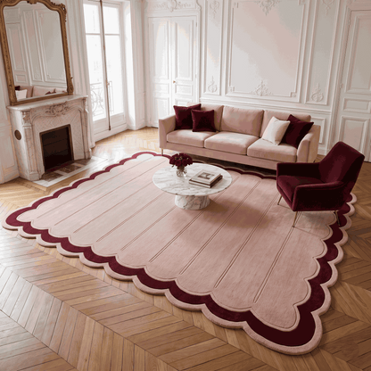 Blush Pink Fluted wool rug with carved vertical channels and a scalloped edge framed by a deep burgundy border.