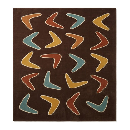 Boomerang Rug with a chocolate brown ground, scattered teal, mustard and rust shapes, and cream outlines