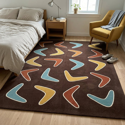Boomerang Rug in chocolate brown wool with scattered teal, mustard, rust and caramel shapes outlined in cream