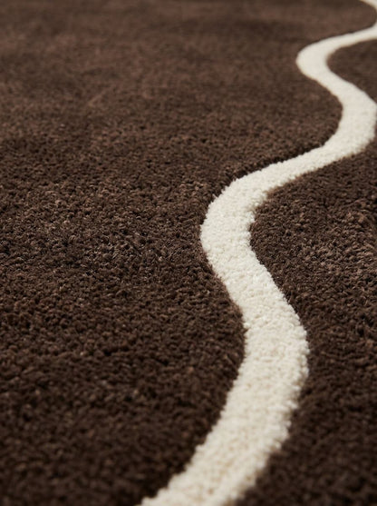Brown Wavy Runner Rug in deep brown wool with a raised ivory wavy line curving across its textured pile