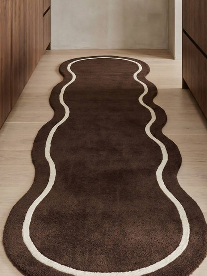 Brown Wavy Runner Rug with a rich chocolate brown pile, flowing organic shape and ivory contour line.