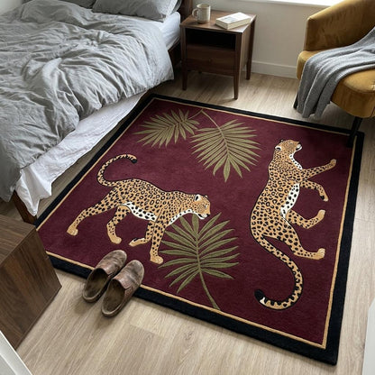 Burgundy Leopard Rug with two tan spotted leopards, olive palm fronds and a fine gold line inside a black border