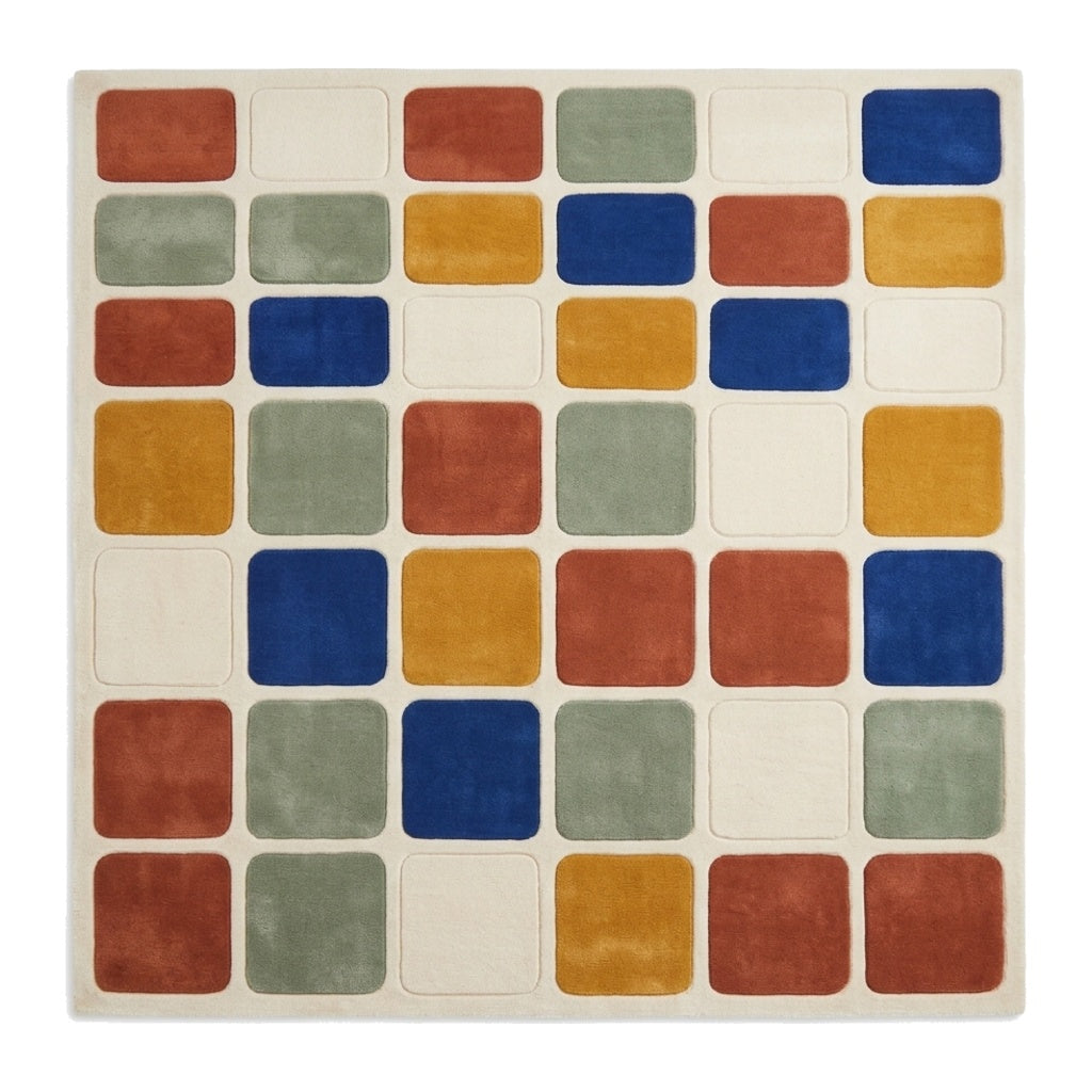 Checkered Rug with a cream wool base and raised rounded squares in rust, cobalt blue, mustard yellow and sage green