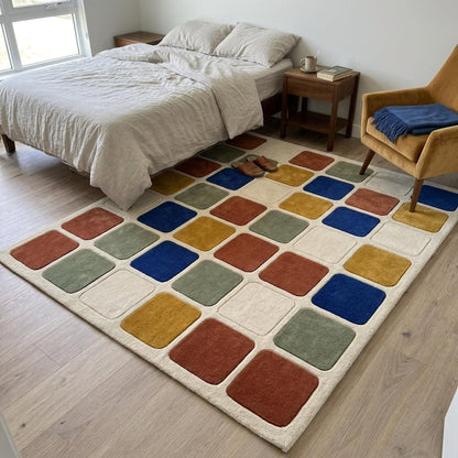 Checkered Rug in cream wool with a grid of raised rust, cobalt blue, mustard and sage rounded squares