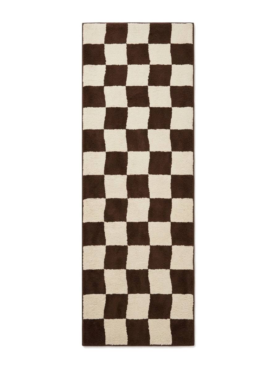 Checkered Runner Rug in chocolate brown and ivory wool, featuring an irregular checkerboard pattern and bound edges