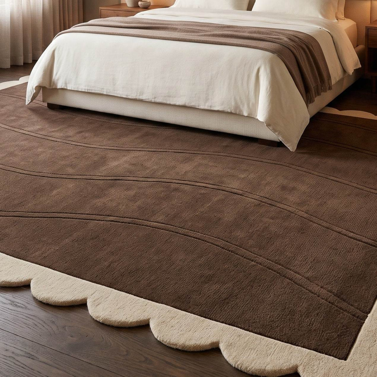 Chocolate Brown Wave wool rug with a plush brown field, carved flowing lines, and a cream scalloped border.