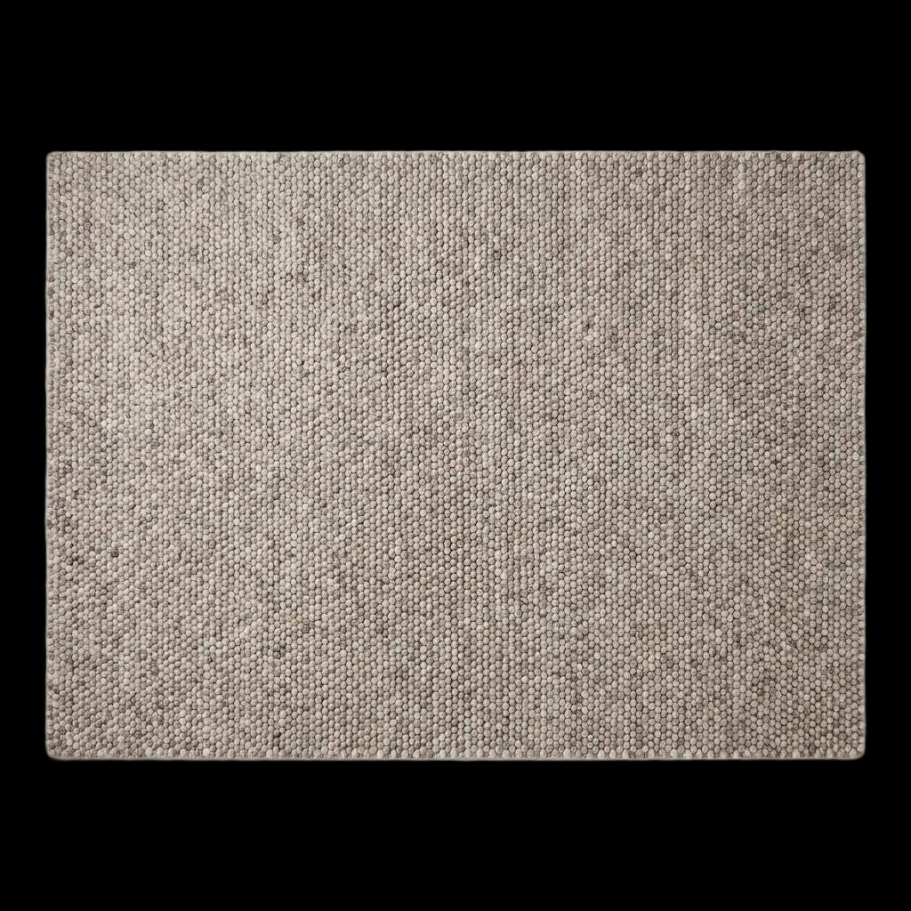 Chunky wool area rug in neutral beige with thick textured weave for cozy minimalist living room decor