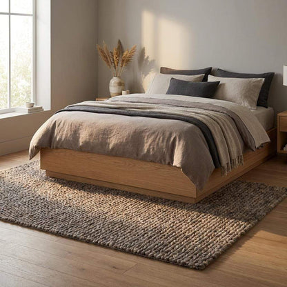 Handwoven chunky wool area rug with thick braided texture in neutral brown tones for modern farmhouse decor