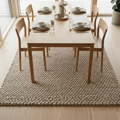 Handwoven chunky wool pebble rug in ivory with thick texture for modern minimalist home decor