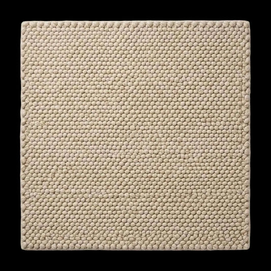 Handwoven chunky wool pebble rug in ivory with textured pebble weave for modern minimalist decor