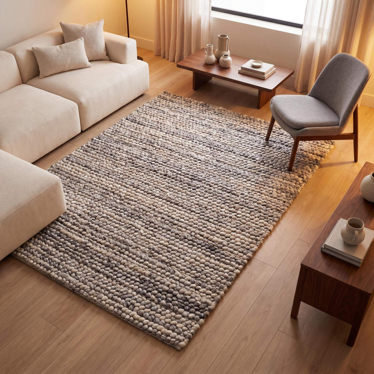 Handwoven chunky wool pebble rug in neutral tones, perfect for modern Scandinavian living rooms