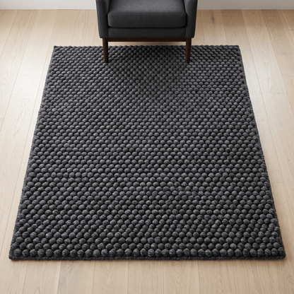 Chunky Wool Rug in charcoal gray with a thick, densely raised pebble texture and softly rounded woven surface
