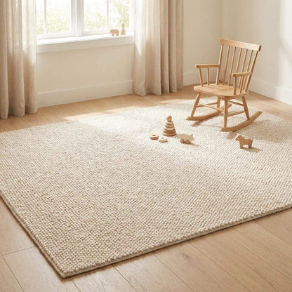 Chunky wool rug with thick handwoven loop pile in neutral cream for cozy minimalist home decor
