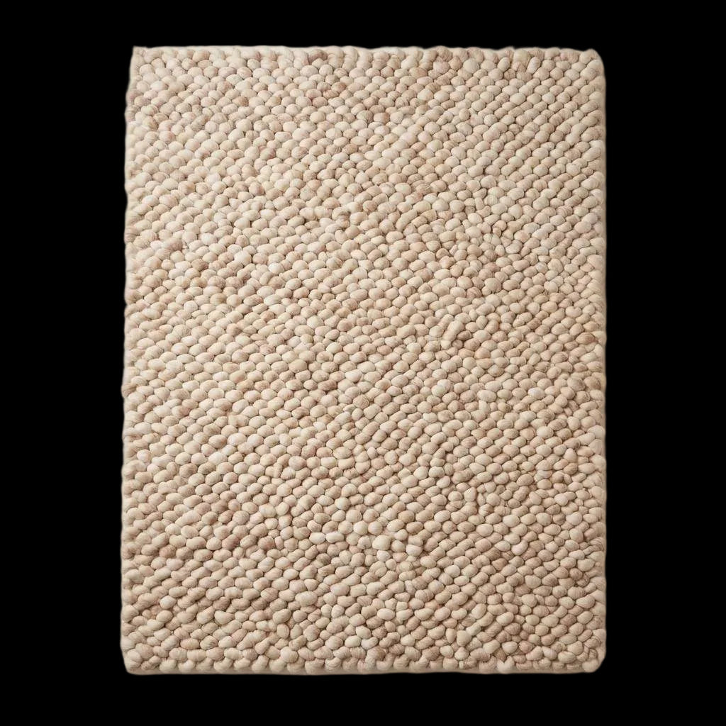 Handmade chunky wool rug with thick knit texture in neutral beige for cozy living room and bedroom decor