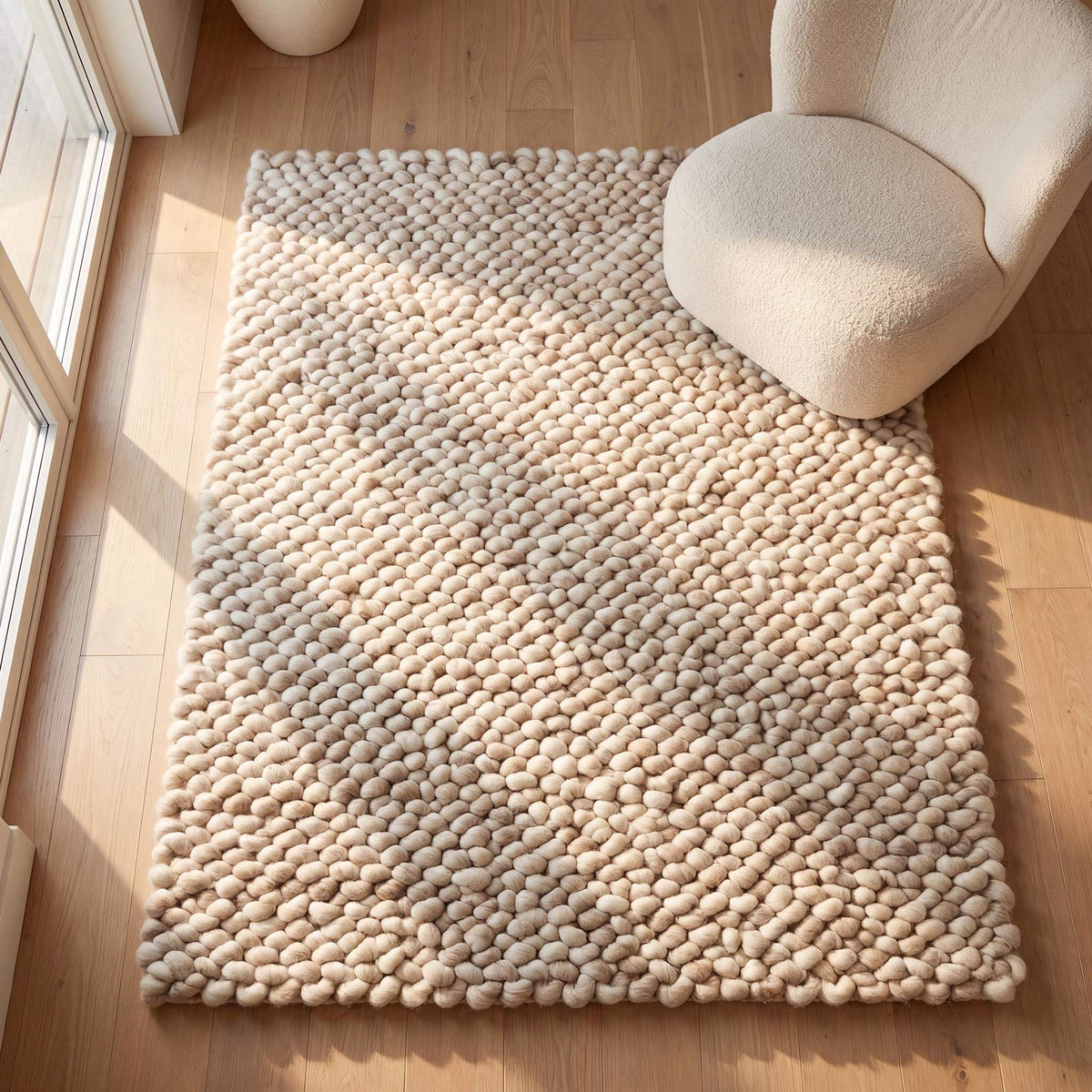 Handmade chunky wool rug with thick knit texture in neutral beige for cozy modern living room and bedroom decor