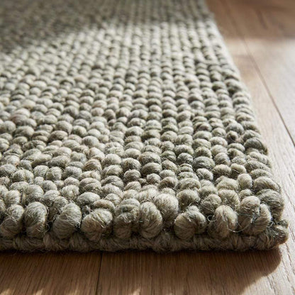 Handmade chunky wool rug with pebble texture in neutral tones for Scandinavian modern farmhouse decor