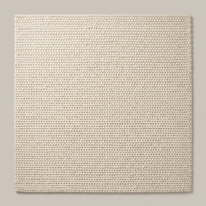 Chunky Wool Rug in ivory cream, with a thick, tightly braided knit texture and neatly aligned rows of loops.