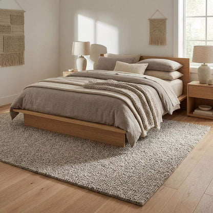 Chunky wool rug with handwoven pebble texture in neutral ivory, ideal for Scandinavian and minimalist living rooms