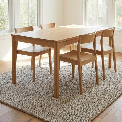 Chunky wool rug with handwoven pebble texture in neutral ivory tones for Scandinavian minimalist living room