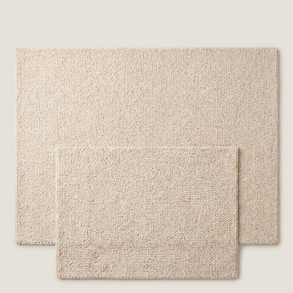 Chunky wool rug with thick handwoven loop pile in neutral cream for cozy minimalist home decor