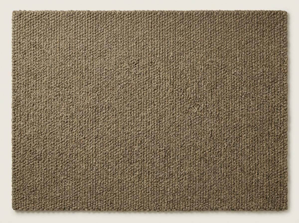 Chunky wool rug with thick loop pile in neutral tones, cozy handmade textured area rug for farmhouse decor