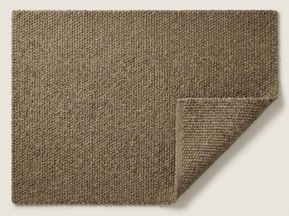 Chunky wool rug with thick loop pile and neutral textured design for cozy farmhouse decor
