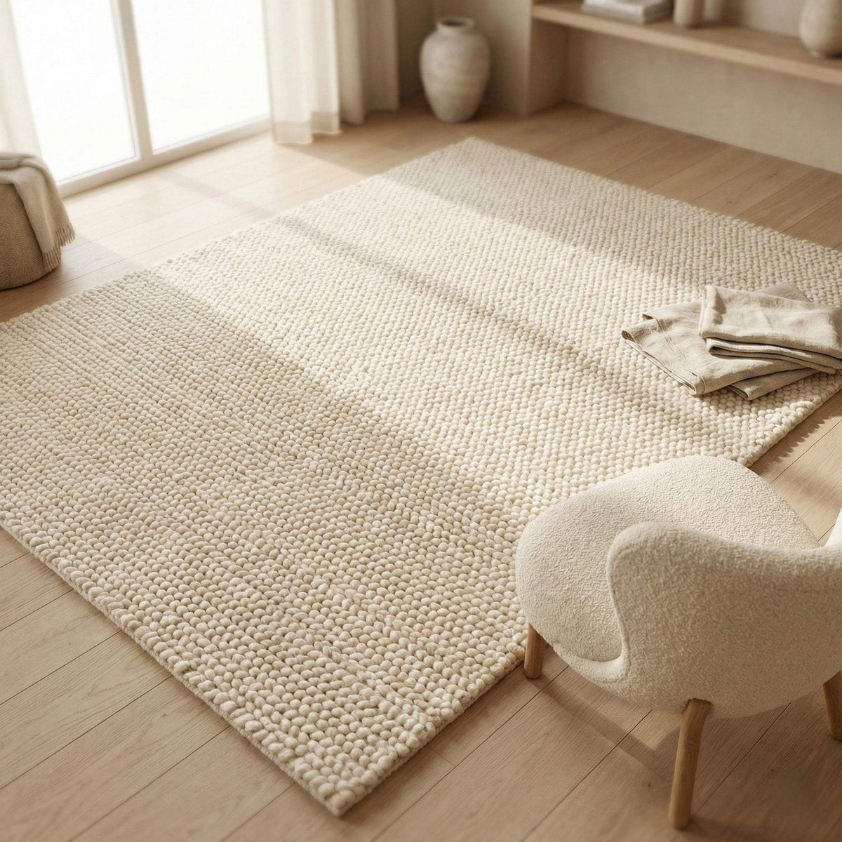 Chunky wool rug with thick plush texture in neutral Scandinavian minimalist living room setting