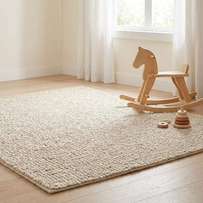 Chunky wool rug with neutral tones and handwoven loop pile texture for cozy minimalist decor