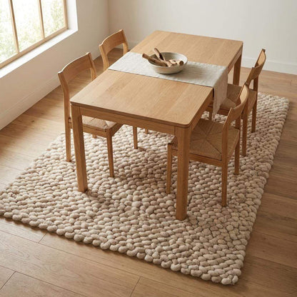 Handmade chunky wool rug with thick knit texture in neutral beige, perfect for cozy living room and bedroom decor