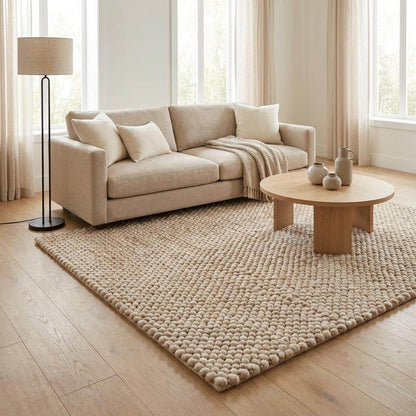 Handmade chunky wool rug with thick knit texture in neutral beige for cozy living room and bedroom decor