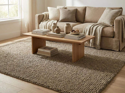 Chunky wool rug with textured loop pile in neutral tones for cozy farmhouse decor