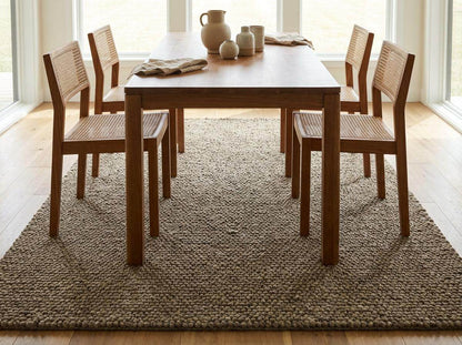 Chunky wool rug with thick loop pile and neutral textured weave for cozy farmhouse decor