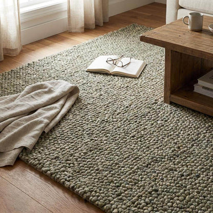 Handmade chunky wool rug with thick pebble texture in neutral tones for Scandinavian and modern farmhouse decor