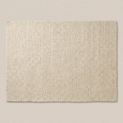 Chunky wool rug in neutral Scandinavian minimalist living room with cozy modern decor
