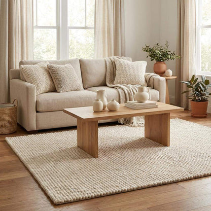 Handwoven chunky wool rug with neutral tones and pebble texture for modern Scandinavian decor