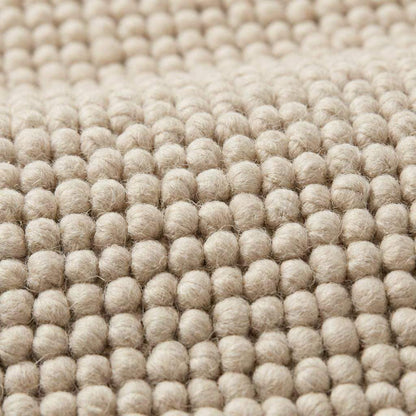 Handmade chunky wool rug thick neutral cozy textured minimalist Scandinavian style floor mat
