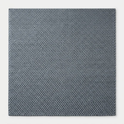 Chunky Wool Rug in slate blue-gray, with a dense handwoven pebble texture and thick, rounded pile.