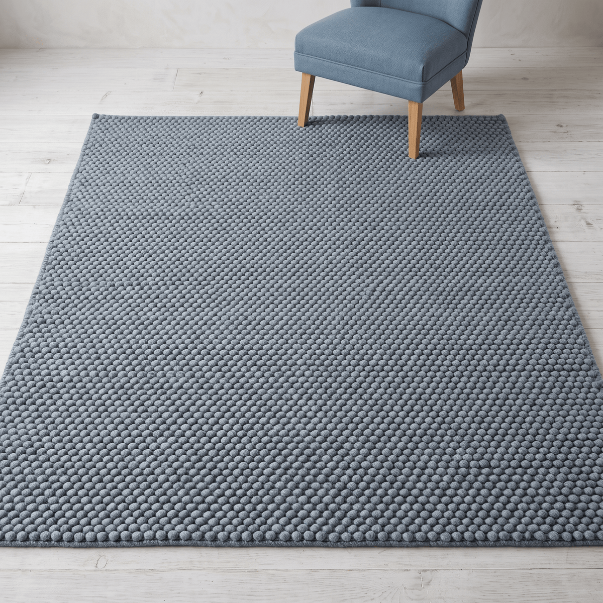 Chunky Wool Rug in slate blue-gray with a thick, handwoven surface of tightly spaced rounded pebble-like loops