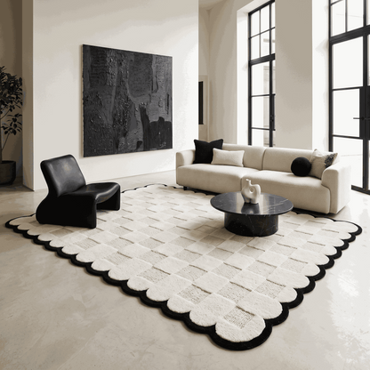 Cream & Black Checkered wool rug with a carved square pattern and bold black scalloped border