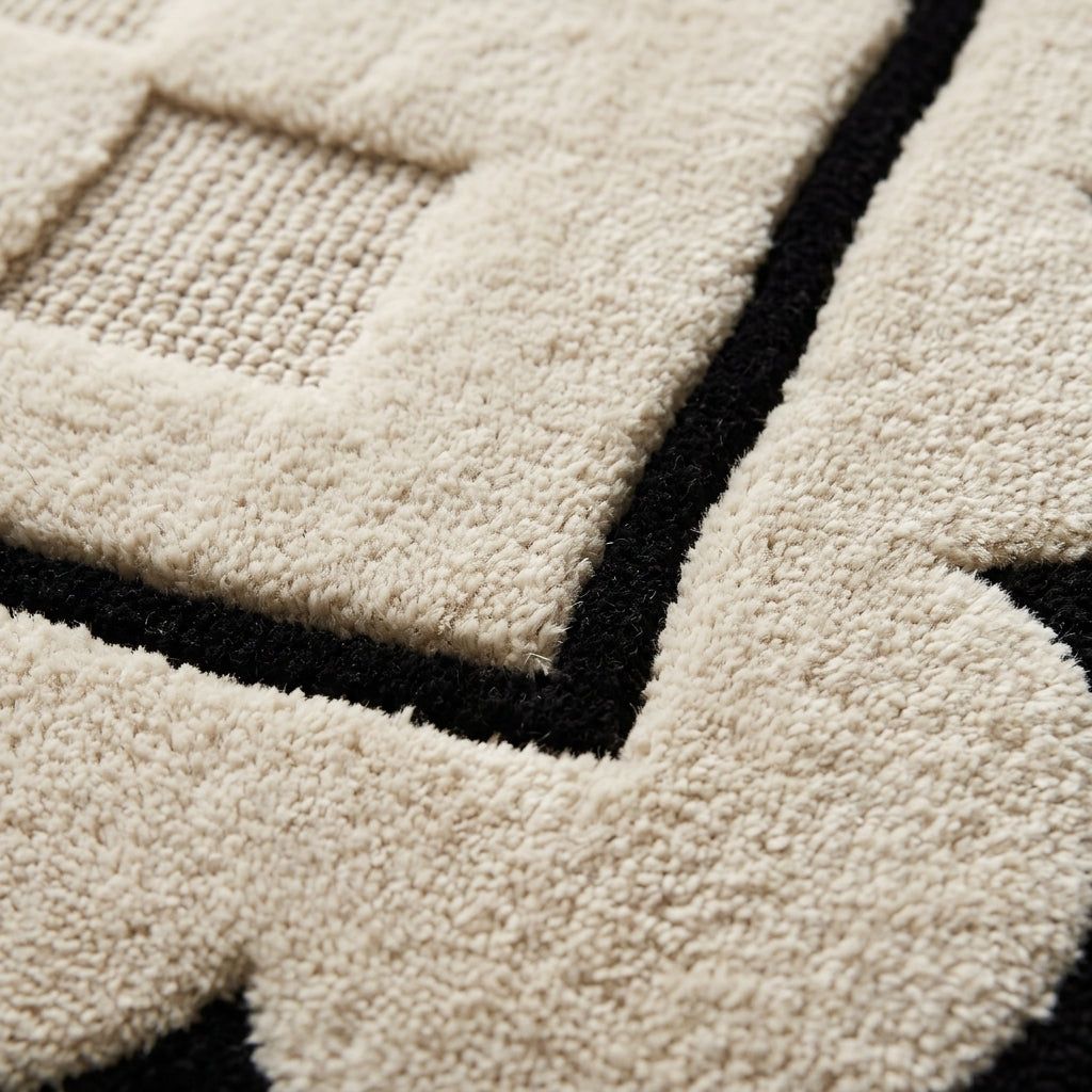 Cream & Black Checkered wool rug with plush hand-tufted texture, raised cream squares and bold black lines.